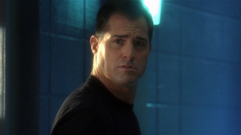 George Eads looking over shoulder