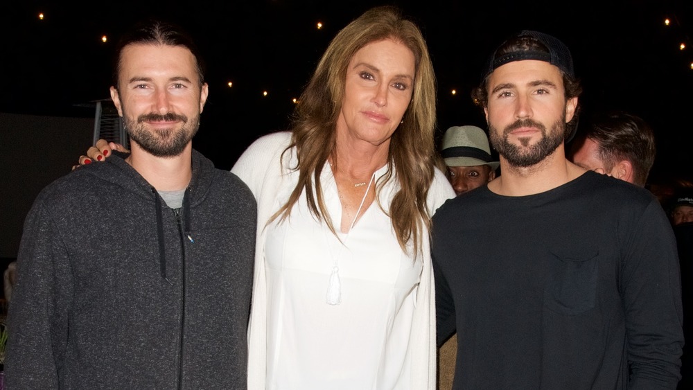 Brandon Jenner, Caitlyn Jenner, and Brody Jenner posing arm in arm