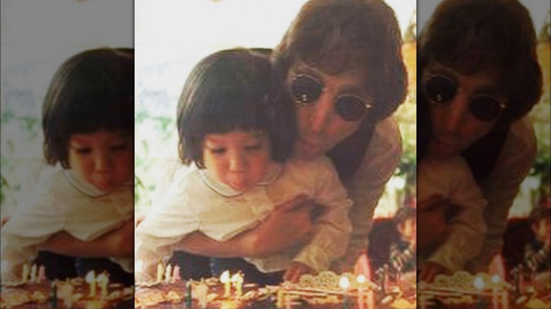 Sean Ono Lennon blowing out his birthday candles with John Lennon