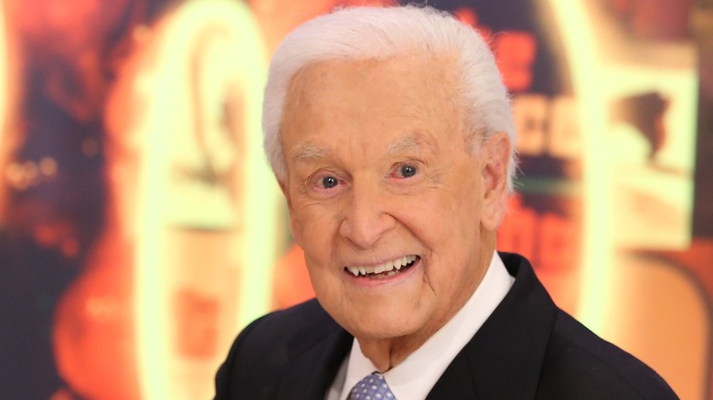 Bob Barker smiles in black suit