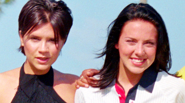 Victoria Beckham and Melanie Chisholm, arm in arm and smiling