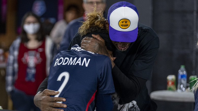 Dennis Rodman and Trinity Rodman embracing