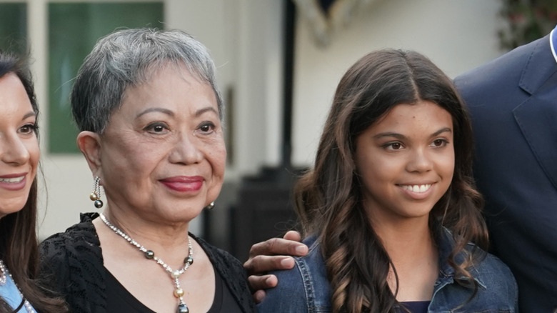 Sam Alexis Woods with her grandmother Kultida Woods