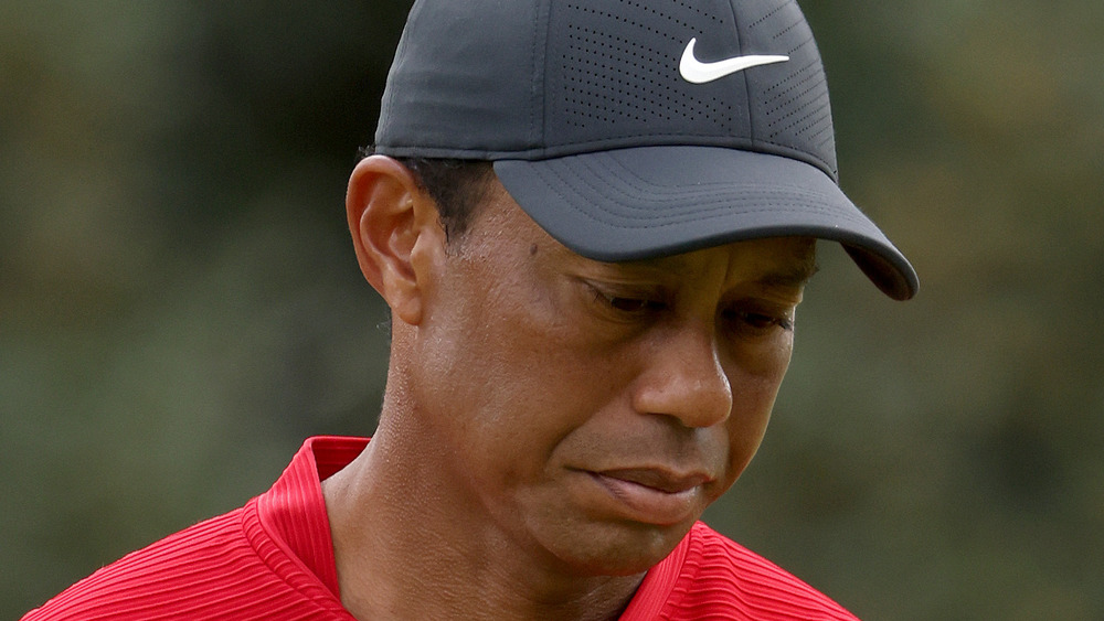 Tiger Woods looking down