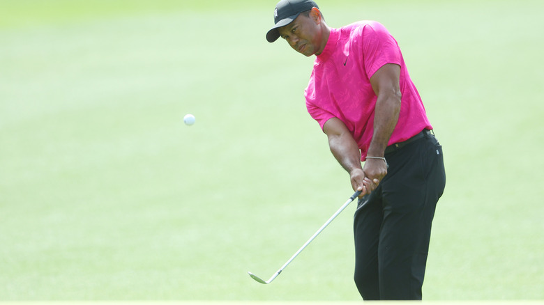 Tiger Woods playing a shot at the 2022 Masters