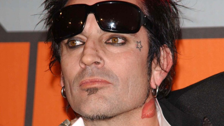 Tommy Lee with sunglasses pushed up