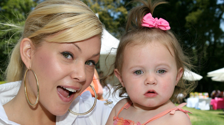 Shanna Moakler holds Alabama Barker as a baby