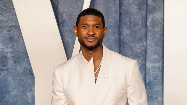 Usher posing on red carpet