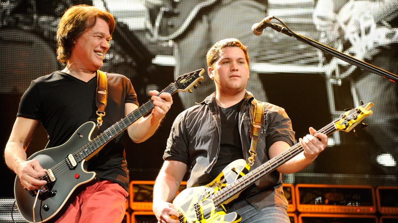 Eddie, Wolfgang Van Halen playing guitars