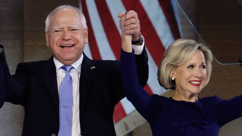 Tim and Gwen Walz smiling at a rally