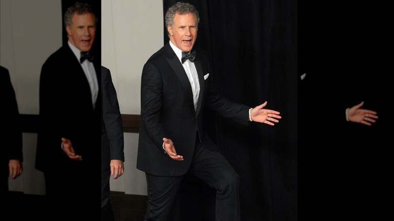 Will Ferrell struts into the press room at the Academy Awards.