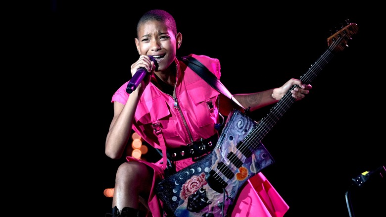 Willow Smith holding guitar