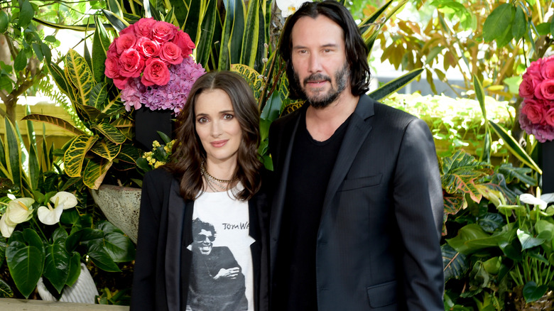 Winona Ryder and Keanu Reeves posing