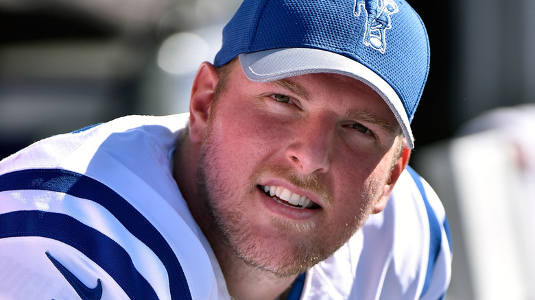 Pat McAfee watching an Indianapolis Colts game from the sidelines