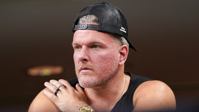 Pat McAfee wearing backwards baseball cap