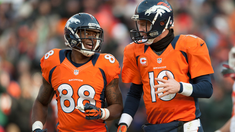 Demaryius Thomas and Peyton Manning talk on the field