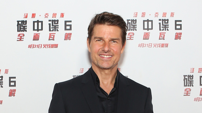 Tom Cruise posing at an event