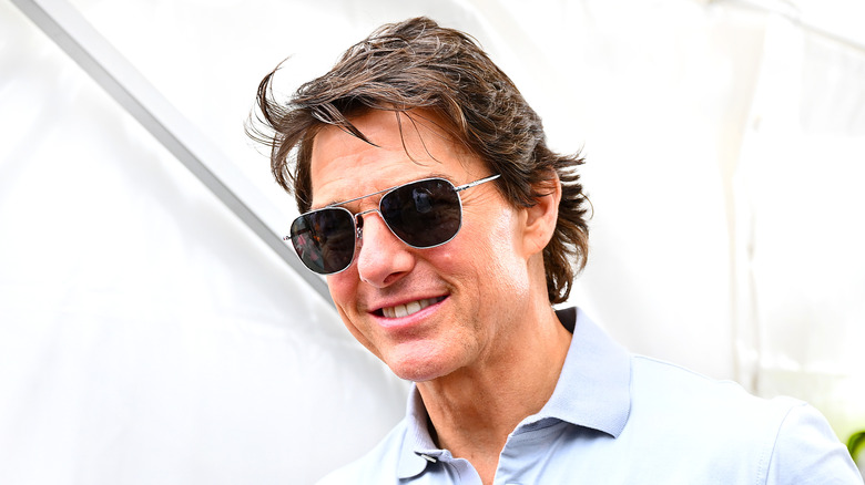 Tom Cruise posing in sunglasses