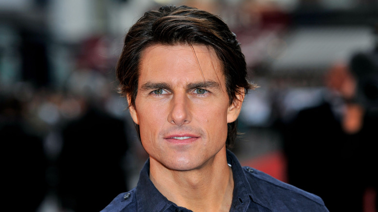 Tom Cruise posing on a red carpet