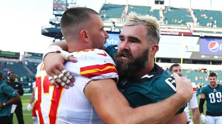 Jason and Travis Kelce hugging after a game