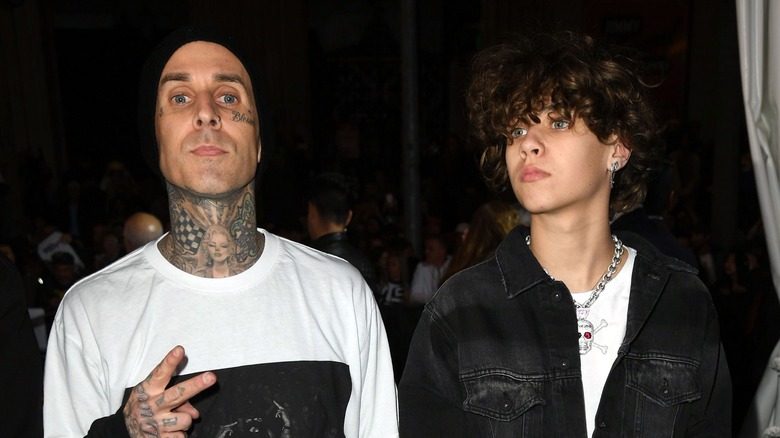 Travis Barker posing with Landon in 2019