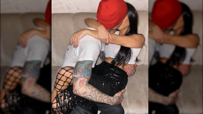 Travis Barker and Kourtney Kardashian kissing