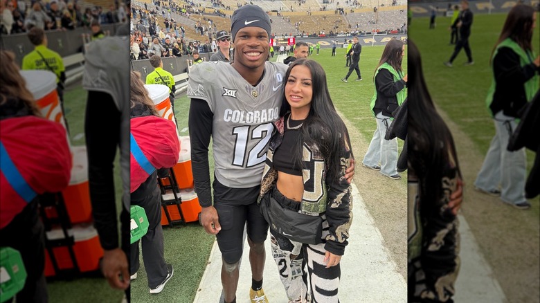 Travis Hunter with Leanna Lenne on the sidelines