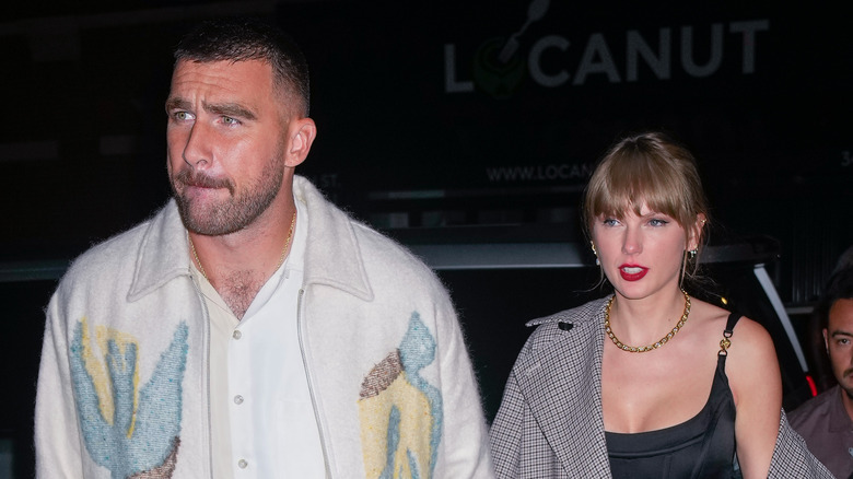 Travis Kelce and Taylor Swift walking