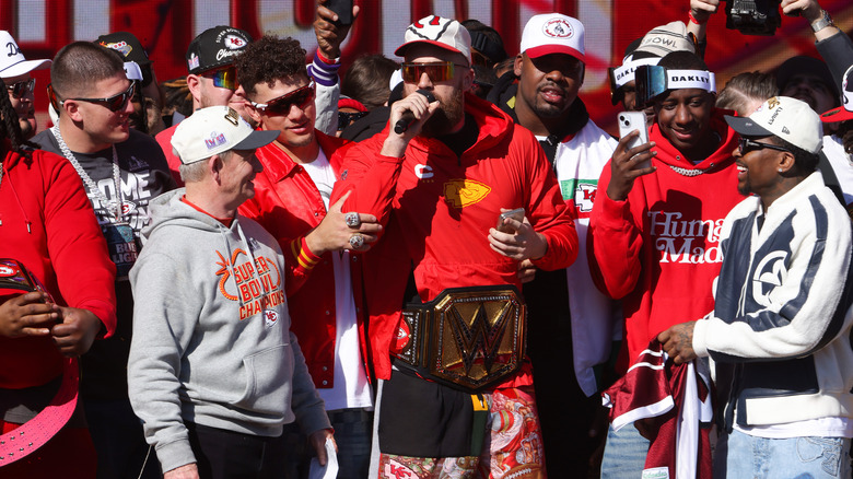 Travis Kelce surrounded by teammates