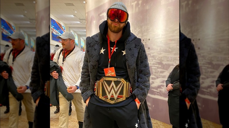 Travis Kelce wearing WWE belt