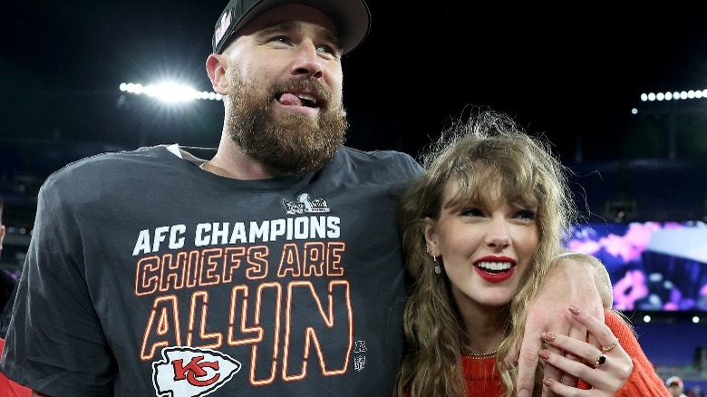 Travis Kelce with his arm around Taylor Swift after a Kansas City Chiefs game (2024)