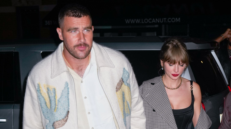 Travis Kelce and Taylor Swift walking