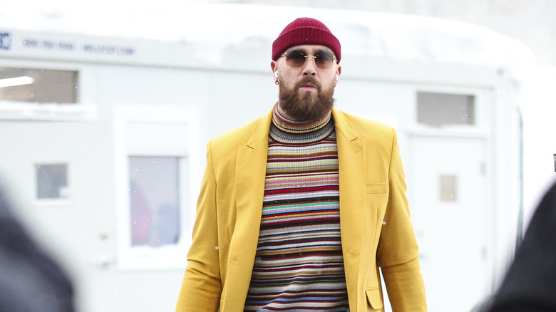 Travis Kelce red hat yellow blazer