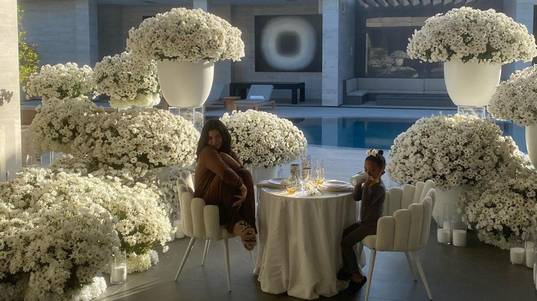 Kylie Jenner and Stormi surrounded by flowers