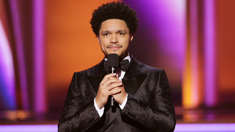 Trevor Noah holding microphone