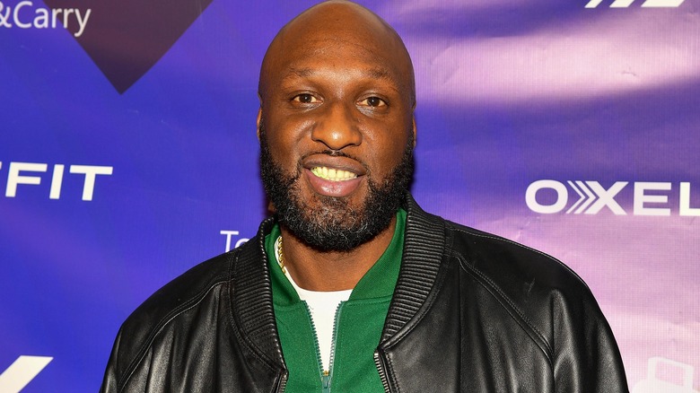 Lamar Odom smiling at an event