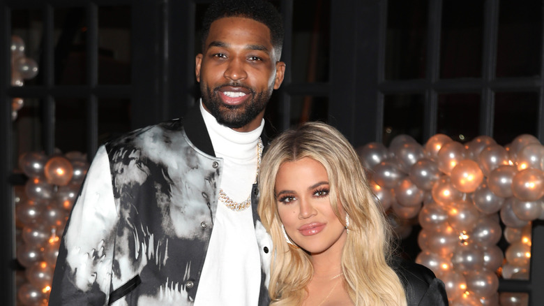 Tristan Thompson, Khloe Kardashian, standing side by side, smiling, 2018 birthday photo