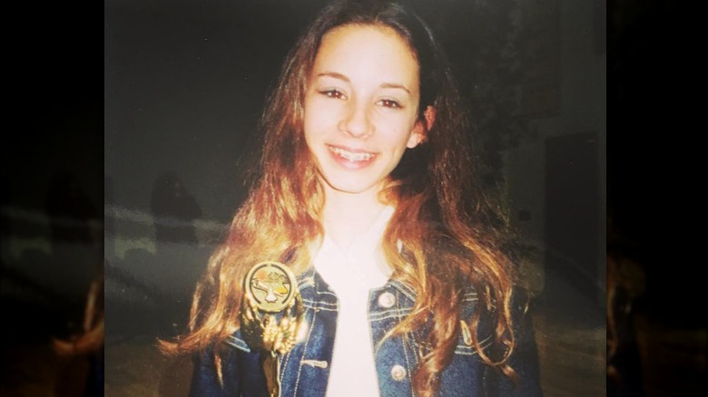 Troian Bellisario as a kid