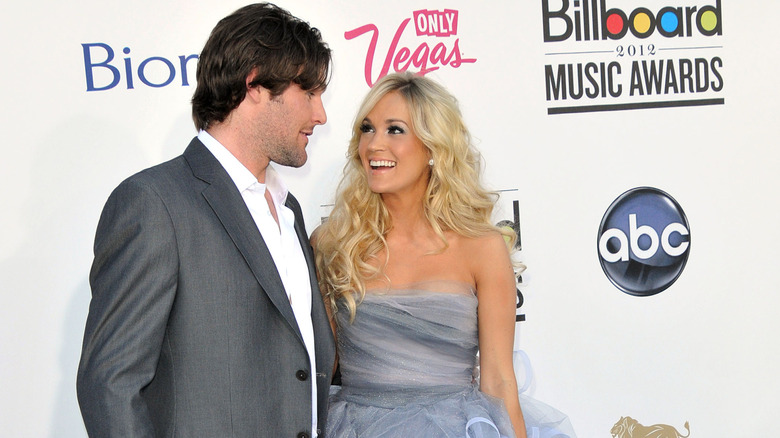 Carrie Underwood and Mike Fisher looking at each other