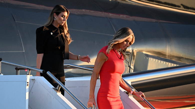 Alina Habba and Lara Trump stepping off a plane