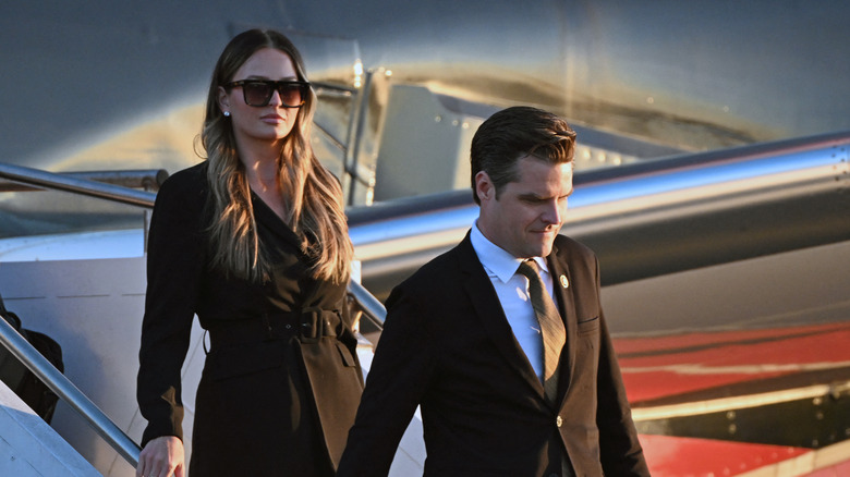 Margo Martin and Matt Gaetz stepping off a plane