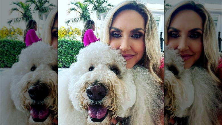 Lara Trump resting chin on dog