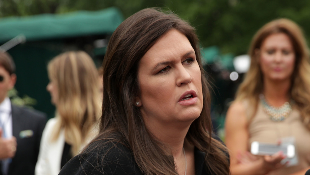 Sarah Huckabee Sanders speaking at a podium