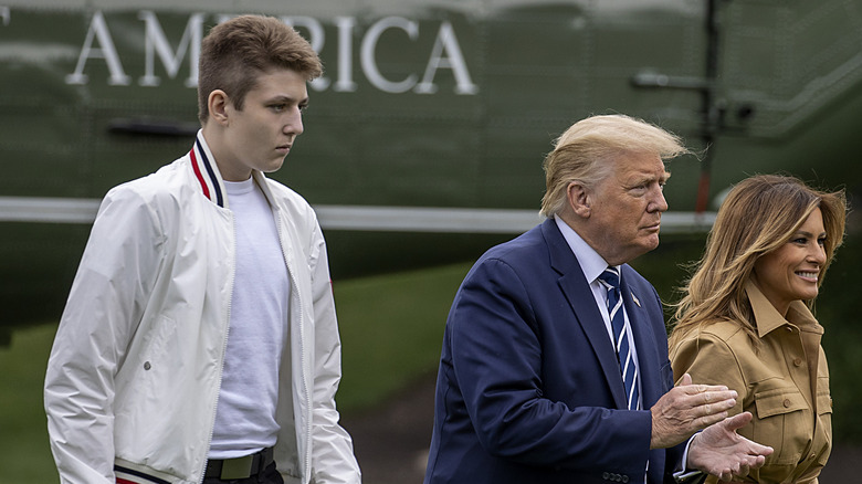 Barron Trump walking with Donald and Melania Trump