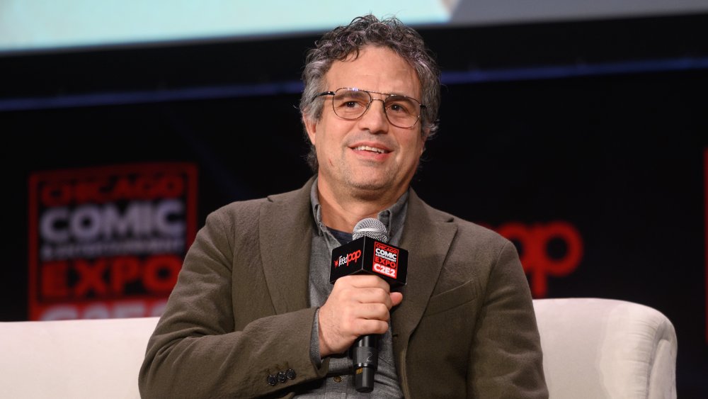 Mark Ruffalo holding a microphone 