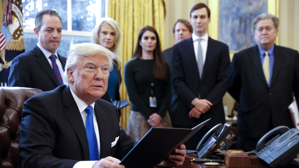 Donald Trump surrounded by his staff including Steve Bannon