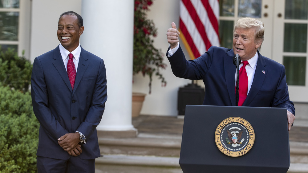 Tiger Woods and Donald Trump at a ceremony