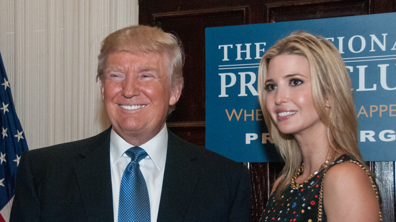 Donald and Ivanka Trump posing at a National Press Club luncheon