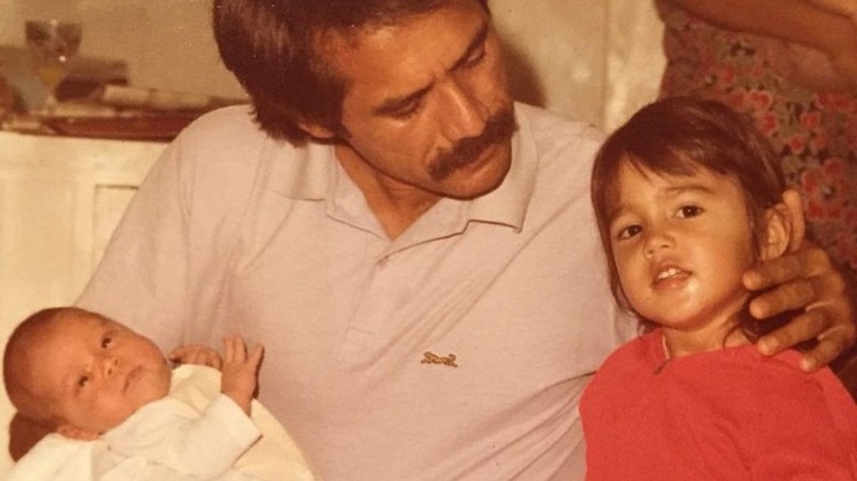 Mike Gabbard posing with his two daughters