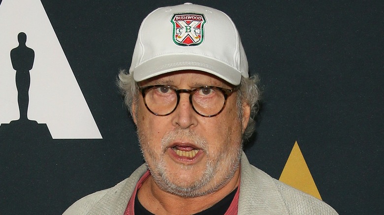 Chevy Chase wearing white hat